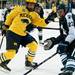 Michigan sophomore left wingman Phil Di Giuseppe tries to separate himself from Michigan State defenders on Friday. Daniel Brenner I AnnArbor.com